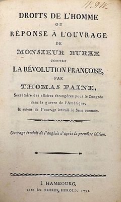 an old book with black writing on it sitting on top of a table