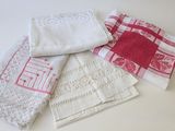 four different types of napkins on a white table