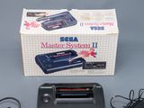 a box with a video game on it and a charger
