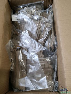 a cardboard box with a bunch of items inside of it