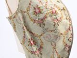 a close up of a mannequin torso with a floral pattern on it