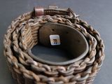 a belt that has a cat on it on a table