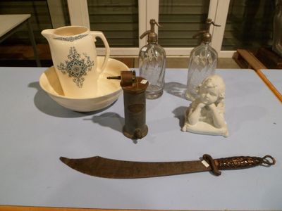 a knife, a cup, and other items on a table