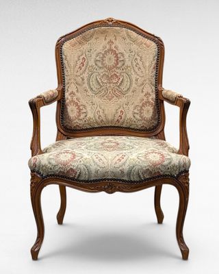 an image of a chair with a floral upholstered seat
