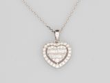 a diamond heart shaped pendant on a chain