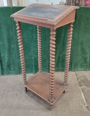an old wooden table with a chalk board on top of it