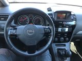 dashboard view of a car with a steering wheel and dashboard controls