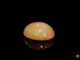 a close up of a white oplite on a black background