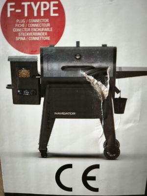 une boîte sur laquelle est représenté un barbecue