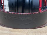 a pair of headphones sitting on top of a wooden table