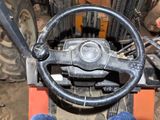 a close up of a steering wheel on a forklift