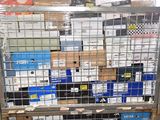 a metal cage filled with boxes and boxes on top of it