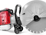 a close up of a red and black circular saw on a white background