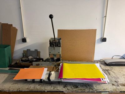 a workbench with a bunch of papers on it