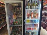 a refrigerated refrigerator in a grocery store