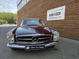 an image of a classic car parked in front of a building