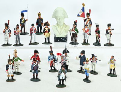 a lot of figurines that are on a white surface