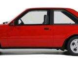 a red car that is parked on a white surface