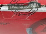 a close up of a red box with a pen in it