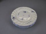 a stack of plates with blue and white designs on them