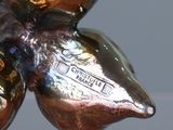 a close up of a shiny metal object on a table