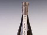 a bottle of wine that is sitting on a table
