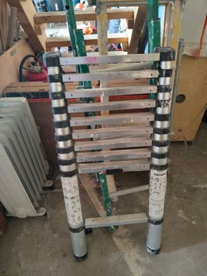 a ladder that is sitting in the middle of a room