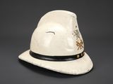 an old white hat with a black band and a star on it