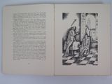 an open book with a drawing of a man sitting on a chair