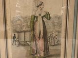 framed picture of a woman in a dress with a hat and a cane