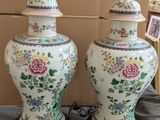two vases that are sitting on a table