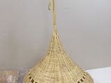 a wicker basket hanging from a hook on the wall