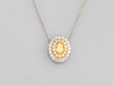 a yellow and white diamond pendant on a chain