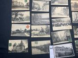 many pictures of old buildings on display on the wall