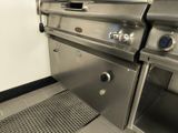 a large stainless steel grill with two burners on the side of it