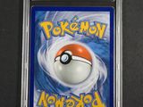 a close up of a card with a pokemon ball on it