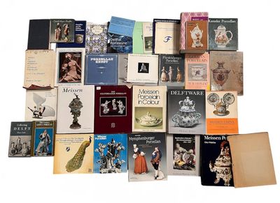 a lot of books that are sitting on a table