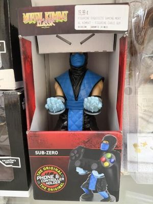 Support téléphone en manette Mortal Kombat Classic 2 représe…