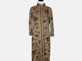a dress with a floral pattern on the front and a long sleeve