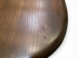 a close up of a wooden object on a table