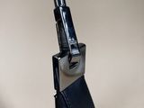 a close up of a bag with a cell phone in it