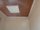 a picture of a room with a ceiling fan and a window