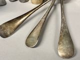 four spoons that are sitting on a table