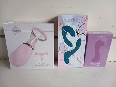 three boxes of different types of sex products sitting on a table