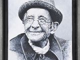 portrait of an old man with a hat and glasses in a frame