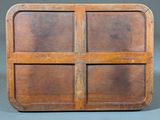 an old wooden box with four compartments on top of it
