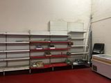 many shelves in a store that have items on them