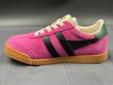 a close up of a pair of pink and black sneakers