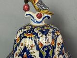 a blue and white turtle with a bird on top of it