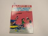 a book on a table with a picture of a cartoon character